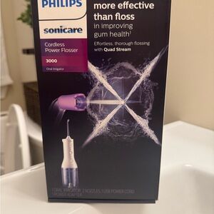 NEW. Philips Sonicare Cordless Power Flosser in Purple and White